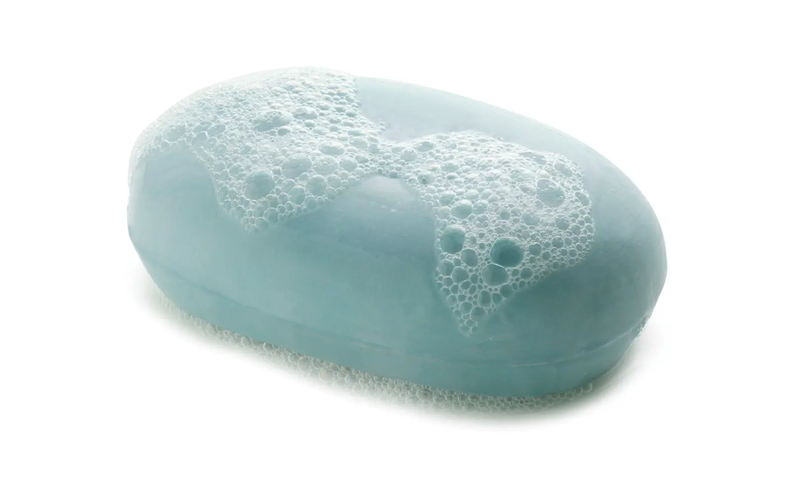 Block of blue soap covered in lather