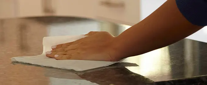 Woman wiping table