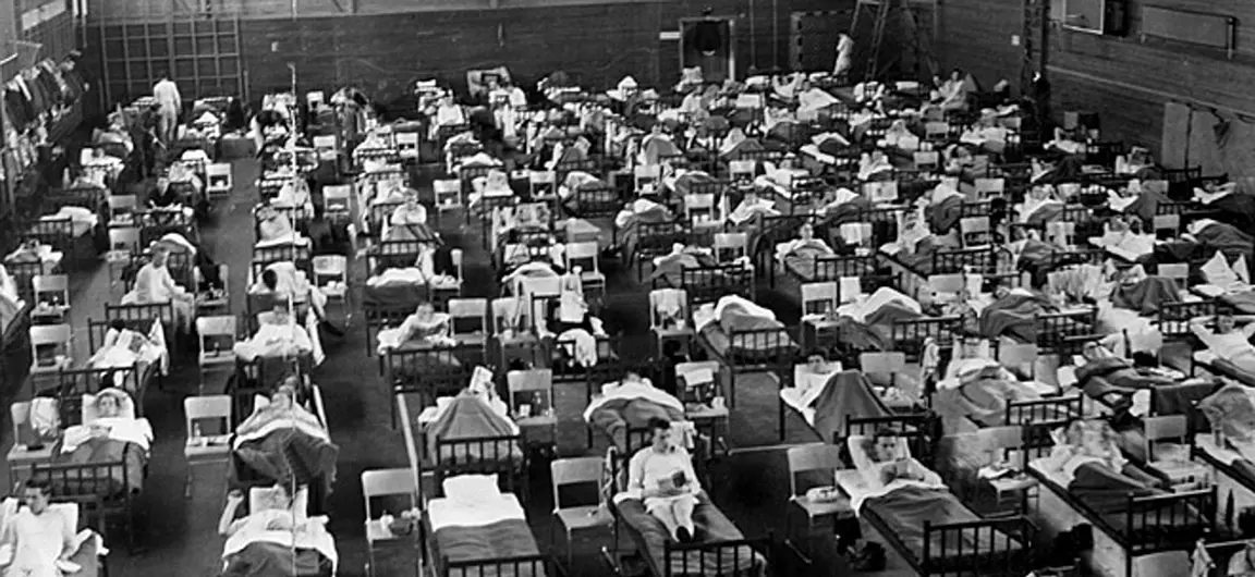 A photograph of a room full of hospital beds resulting from Asian flu in Sweden 1957.