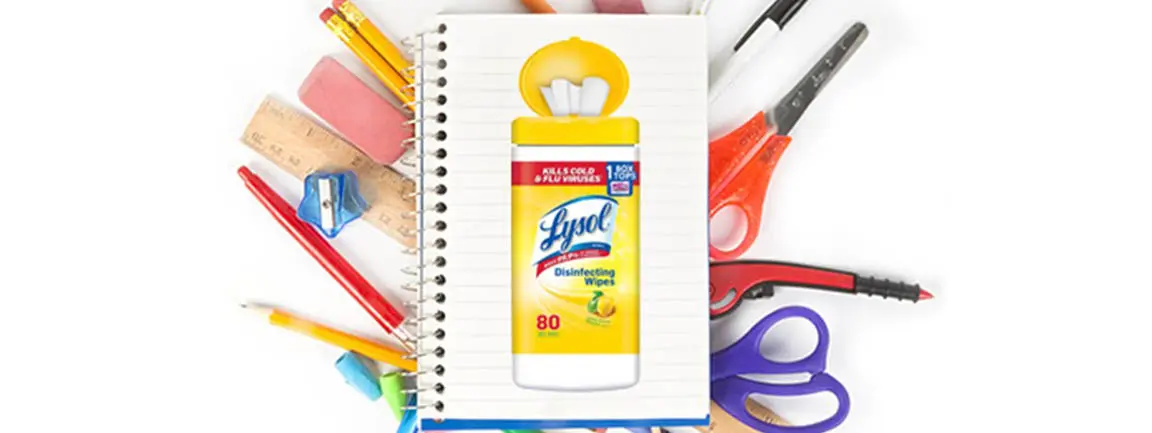 Image of Lysol Disinfecting Wipes on spiral bound pad on top of pile of stationary