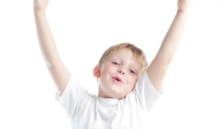 Child holding hands up in the air