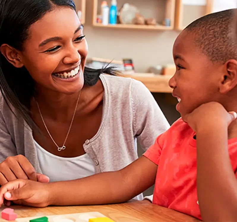 teacher and student smiling