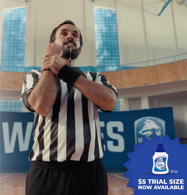 Coach standing with whistle and 5$ trial size lysol laundry sanitizer