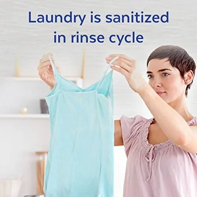 Clean athleticwear being held up in front of an adult. Text says "Laundry is sanitized in rinse cycle"