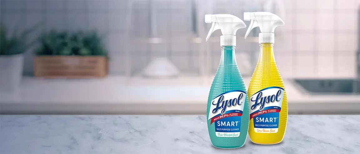 Bottles of Lysol Smart Multi Purpose Cleaner on a kitchen counter. One bottle is Fresh Waterfall Scent. One bottle is Citrus Breeze Scent
